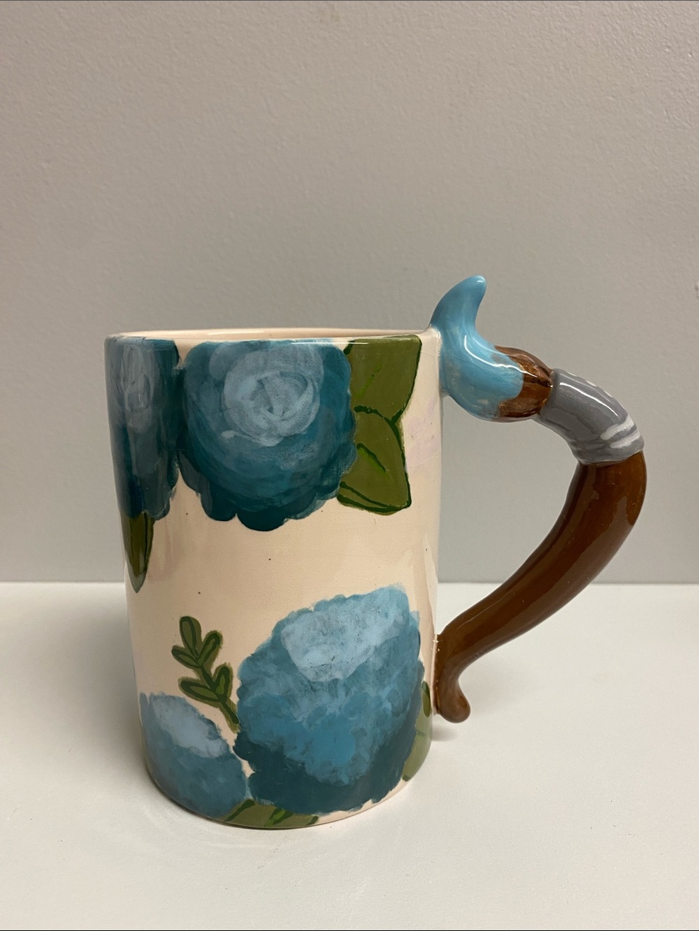 Hand-Painted Blue Floral Ceramic Mug with Brown Handle